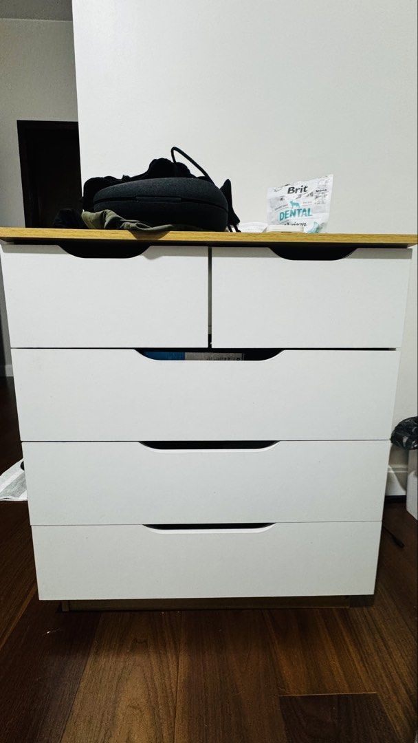 4 tier - 5 Drawer: Dresser (Category: Shelves, Cabinets & Racks) located in Taguig. Submitted by silverdragon_458bb4 (Listing ID 1467354058, Image 2). Description: RFS: Moved to a new condo and have no more use for this Dresser. 4 tier - 5 Drawer: White & wood. No damage or missing pieces. Used for personal garments, mostly t-shirts. 2k or OBO.