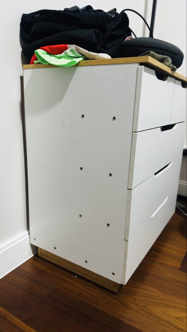 4 tier - 5 Drawer: Dresser (Category: Shelves, Cabinets & Racks) located in Taguig. Submitted by silverdragon_458bb4 (Listing ID 1467354058, Image 3). Description: RFS: Moved to a new condo and have no more use for this Dresser. 4 tier - 5 Drawer: White & wood. No damage or missing pieces. Used for personal garments, mostly t-shirts. 2k or OBO.