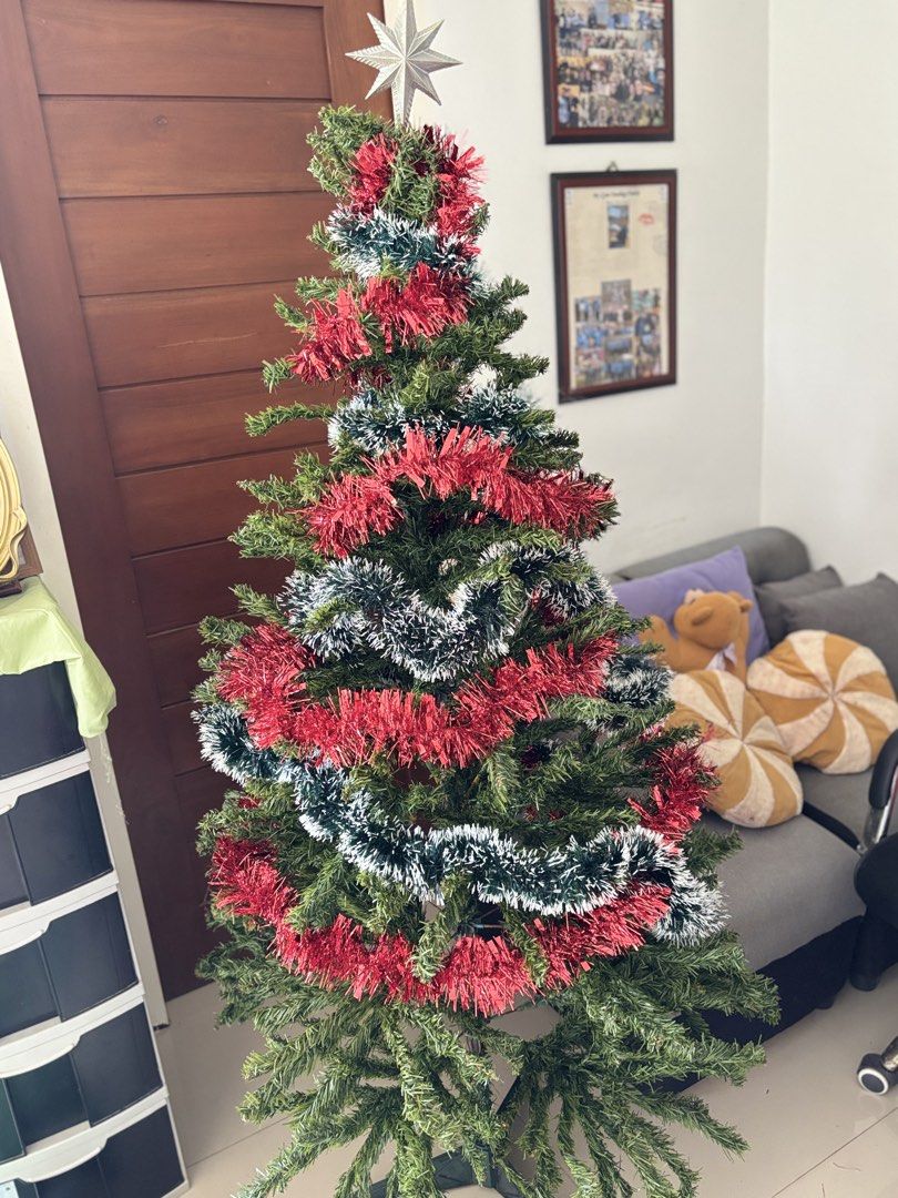5 ft christmas tree (Category: Other Home Decor) located in Manila. Submitted by lavieelle (Listing ID 1469416426, Image 2). Description: - preloved 5ft christmas tree - comes with free garland and star decorations - bought at sm store & selling as is - delivery via lalamove or grab - rfs: spare, decluttering as well.
