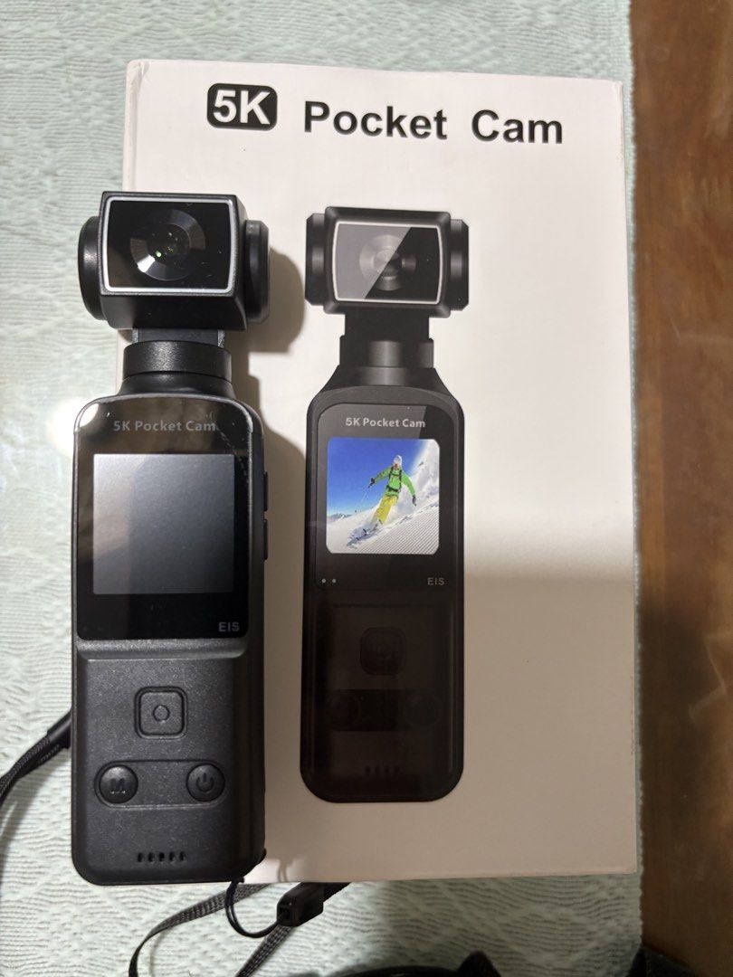 5K Pocket Cam EIS Gimbal Camera with Accessories (Category: Cameras) located in Muntinlupa City. Submitted by koi_143 (Listing ID 1469475167, Image 1). Description: - 5K Pocket Camera with Electronic Image Stabilization - Condition: Powers on, gimbal mechanism moves freely - Ideal for vlogging and travel videos - Includes 128GB microSD card - Comes with original box, storage pouch, lapel microphone, mounting bracket, and straps - All pictured ite