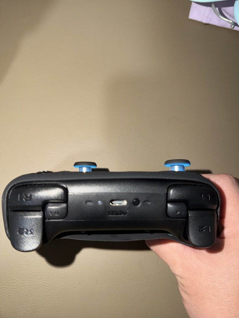 8bitdo controller (Category: Controllers) located in Singapore. Submitted by javier.chng (Listing ID 1469403507, Image 3). Description: Controller only used twice for racing games but not suitable to me, both times also use at most 2 hours each Battery life is 8hours per charge at least Silicone cover also included as well as charging dock Box also still have .