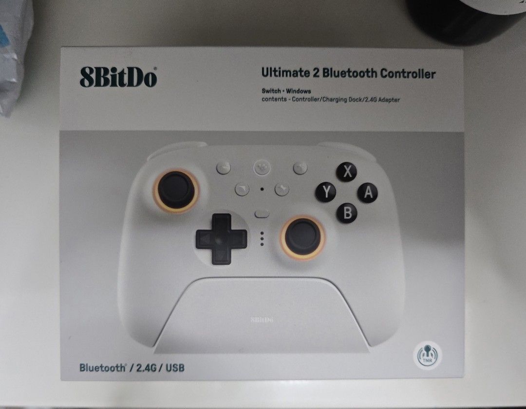 8BitDo Ultimate 2 Bluetooth Controller for Switch / Windows (Category: Controllers) located in Singapore. Submitted by jeremiajemima (Listing ID 1469527397, Image 1). Description: - Model: 8BitDo Ultimate 2 Bluetooth Controller (White) - Compatibility: Nintendo Switch, Switch 2 and Windows PC. Able to connect to iPad, phone etc. - Condition: Used once, after that kept back in box - Includes: controller and charging dock.