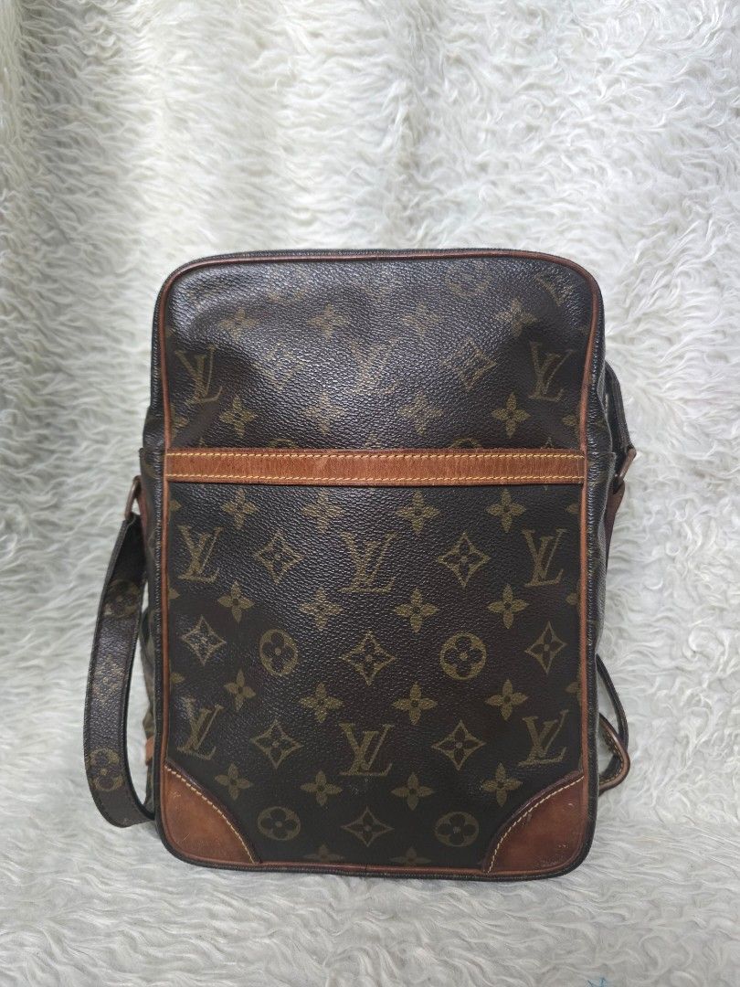 💯% AUTHENTIC Louis Vuitton Monogram DANUBE GM (Category: Backpacks) located in Marikina City. Submitted by dust.end.bags (Listing ID 1469567723, Image 1). Description: - Authentic Louis Vuitton monogram canvas backpack - Dark leather trim with stylish corner patches - Classic brown print featuring a structured vertical center stripe - Adjustable straps attached at the bottom for comfortable wear - Practical everyday bag with a spacious interior.