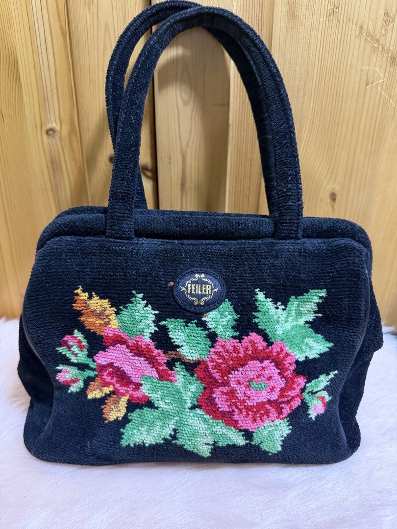 ✨ Beautiful Vintage FEILER Germany Chenille Handbag ✨ (Category: Tote Bags) located in Taguig. Submitted by narsdenise (Listing ID 1469424370, Image 1). Description: • Brand: Authentic FEILER Germany • Color: Jet Black with multi-color floral pattern (pinks, reds, greens, and oranges) • Material: Premium Chenille Cotton / Pile Fabric • Style: Classic Top-Handle Mini Satchel • Condition: Beautiful pre-loved vintage condition. Structurally sound wi