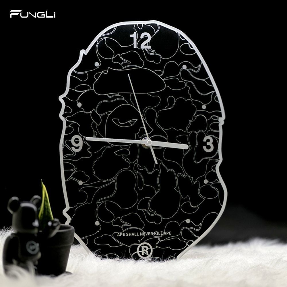 A Bathing Ape BAPE Camo Ape Head Wall Clock (Category: Clocks) located in Manila. Submitted by michateng246031 (Listing ID 1469464868, Image 2). Description: - Authentic BAPE Ape Head logo wall clock - Classic black and white camouflage design - White hour markers at 12, 3, and 9 o'clock with high-contrast white hands - Features iconic 'APE SHALL NEVER KILL APE' text near the bottom - Battery-operated for easy placement anywhere in your room.