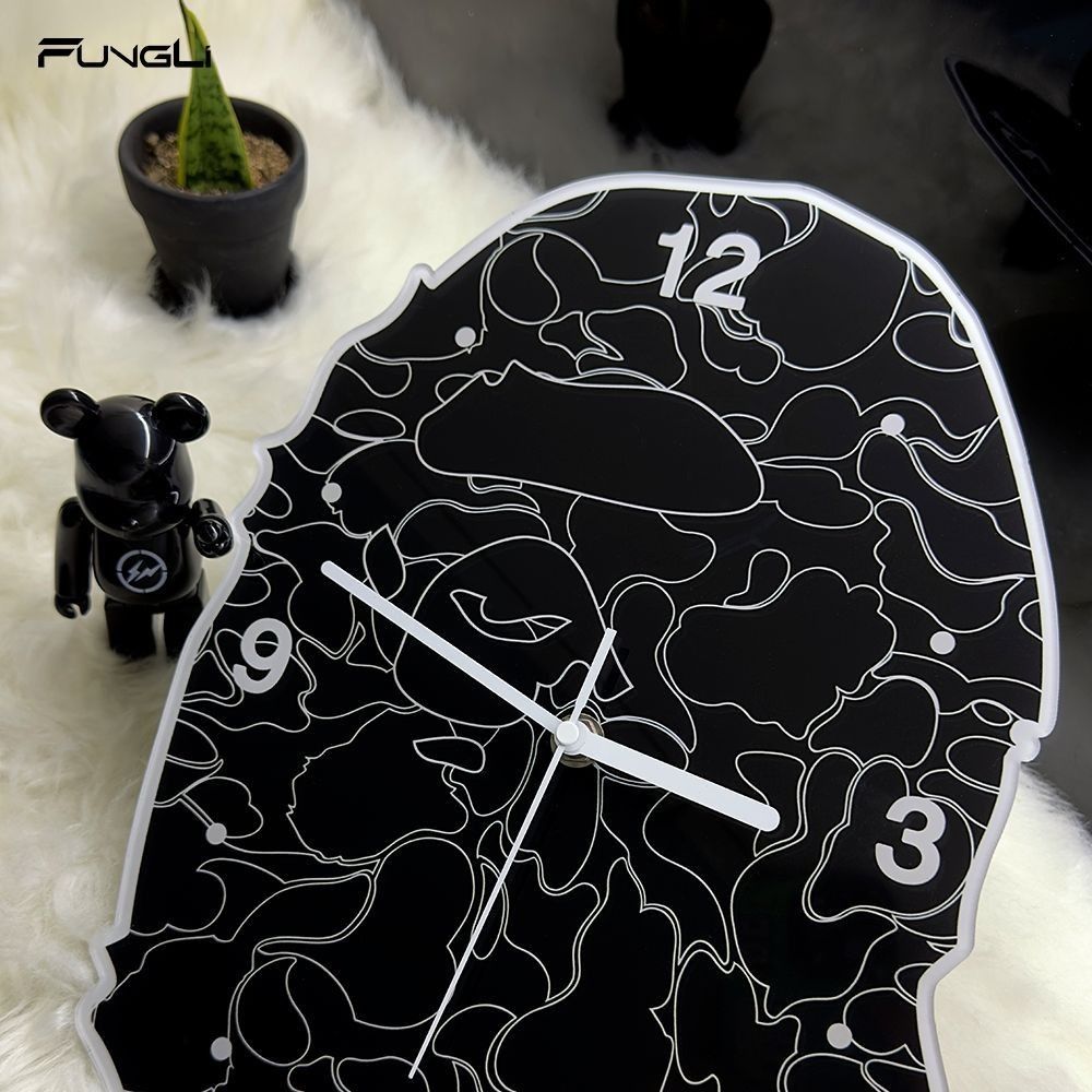 A Bathing Ape BAPE Camo Ape Head Wall Clock (Category: Clocks) located in Manila. Submitted by michateng246031 (Listing ID 1469464868, Image 1). Description: - Authentic BAPE Ape Head logo wall clock - Classic black and white camouflage design - White hour markers at 12, 3, and 9 o'clock with high-contrast white hands - Features iconic 'APE SHALL NEVER KILL APE' text near the bottom - Battery-operated for easy placement anywhere in your room.