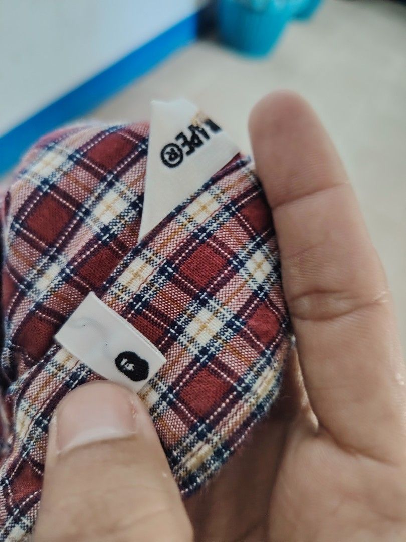 A Bathing Ape Classics Plaid Long Sleeve Shirt (Category: Formal Shirts) located in Roxas, Palawan. Submitted by act_thrift_palawan (Listing ID 1469395840, Image 3). Description: - Brand: A Bathing Ape Classics - Item: Red plaid long sleeve shirt - Size: Medium - Details: Button-down collar, front button closure, single chest pocket with embroidered ape logo - Authenticity: Features gold Ape head label inside - Care Instructions: Hand wash separa