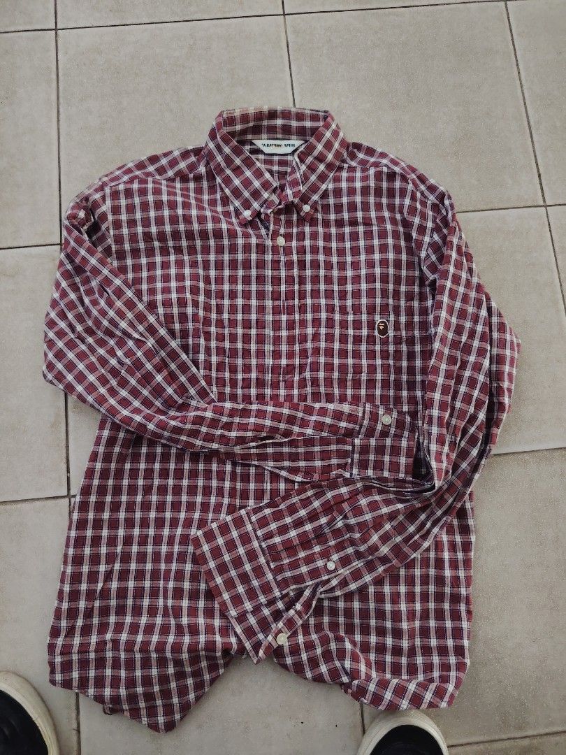A Bathing Ape Classics Plaid Long Sleeve Shirt (Category: Formal Shirts) located in Roxas, Palawan. Submitted by act_thrift_palawan (Listing ID 1469395840, Image 1). Description: - Brand: A Bathing Ape Classics - Item: Red plaid long sleeve shirt - Size: Medium - Details: Button-down collar, front button closure, single chest pocket with embroidered ape logo - Authenticity: Features gold Ape head label inside - Care Instructions: Hand wash separa