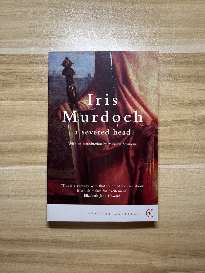 A Severed Head by Iris Murdoch (Category: Storybooks) located in Quezon City. Submitted by ekrudieter (Listing ID 1469483870, Image 1). Description: - Title: A Severed Head by Iris Murdoch - Publisher: Vintage Classics (with Miranda Seymour introduction) - Format: Standard paperback - Condition: Good read, with minor yellowing on page edges - Ideal for: Fans of classic literature and philosophy.
