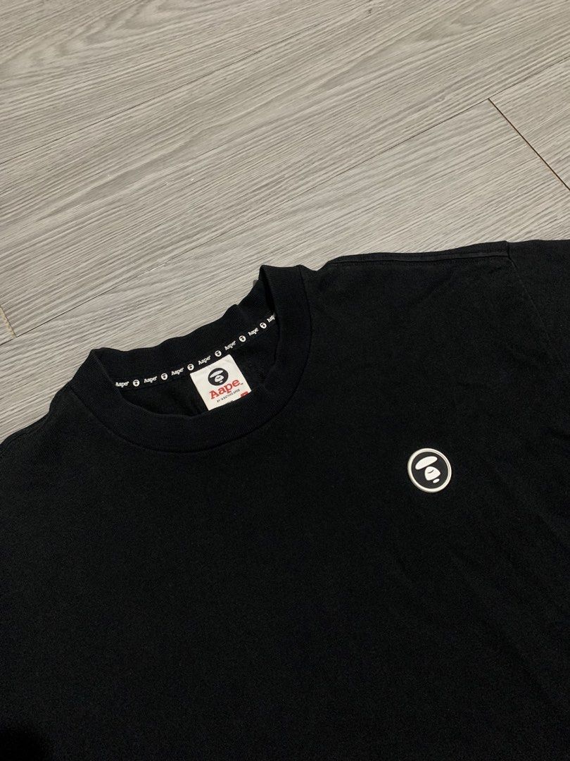 AAPE by A Bathing Ape Moonface Logo-Patch Black T-Shirt (Category: Tshirts & Polo Shirts ) located in Pozorrubio. Submitted by plco. (Listing ID 1469525842, Image 2). Description: AAPE by A Bathing Ape Moonface Logo-Patch Black T-Shirt S on tag 21x28 color rate: 10/10 complete tags repaired pinhole no other issues.
