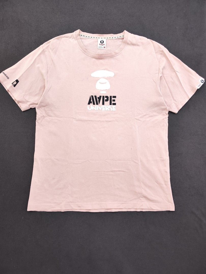Aape Universe Pink Tee (Category: Tshirts & Polo Shirts ) located in Bulacan. Submitted by emilj23 (Listing ID 1469430745, Image 1). Description: Aape Universe Pink Tee Size XL on tag L 30 W 23 Condition 8/10 Color rate 8/10 Issue Crackprints,Stains,Pinhole.