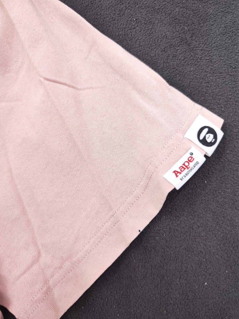 Aape Universe Pink Tee (Category: Tshirts & Polo Shirts ) located in Bulacan. Submitted by emilj23 (Listing ID 1469430745, Image 3). Description: Aape Universe Pink Tee Size XL on tag L 30 W 23 Condition 8/10 Color rate 8/10 Issue Crackprints,Stains,Pinhole.