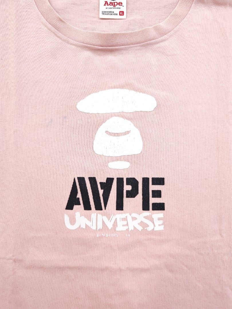 Aape Universe Pink Tee (Category: Tshirts & Polo Shirts ) located in Bulacan. Submitted by emilj23 (Listing ID 1469430745, Image 2). Description: Aape Universe Pink Tee Size XL on tag L 30 W 23 Condition 8/10 Color rate 8/10 Issue Crackprints,Stains,Pinhole.