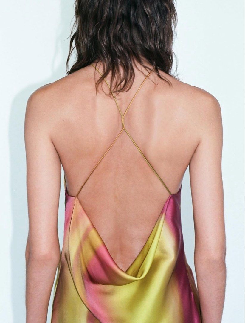 Abstract Floral Halter Maxi Dress Low Back (Category: Dresses) located in Manila. Submitted by cardonesem04209 (Listing ID 1469501349, Image 2). Description: - Style: Long halter neck maxi dress with a dramatic low cowl back - Design: Vibrant abstract watercolor floral pattern in yellow, pink, and green - Details: Thin crisscross back straps and smooth fabric with a subtle sheen - Condition: Worn once for a mirror selfie, practically untouched an
