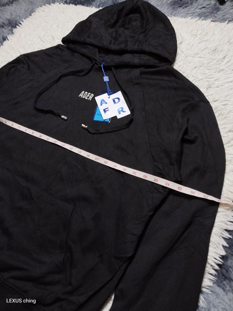 ADER error fullover with tape print on front and lining stitching tape on back. (Category: Hoodies) located in Manila. Submitted by lexusthrift1995 (Listing ID 1469502432, Image 2). Description: Size- LARGE to XL Dimension- 24x28 Color rate- 10/10 Condition- 10/10 issue- no issue brand condition good condition ‼️650.pesos plus shipping fee 💸MODE OF PAYMENT- GCASH payment first 🚛MODE OF DELIVERY- J&T or LALAMOVE 📍LOCATION- NORTH CALOOCAN CAMARI