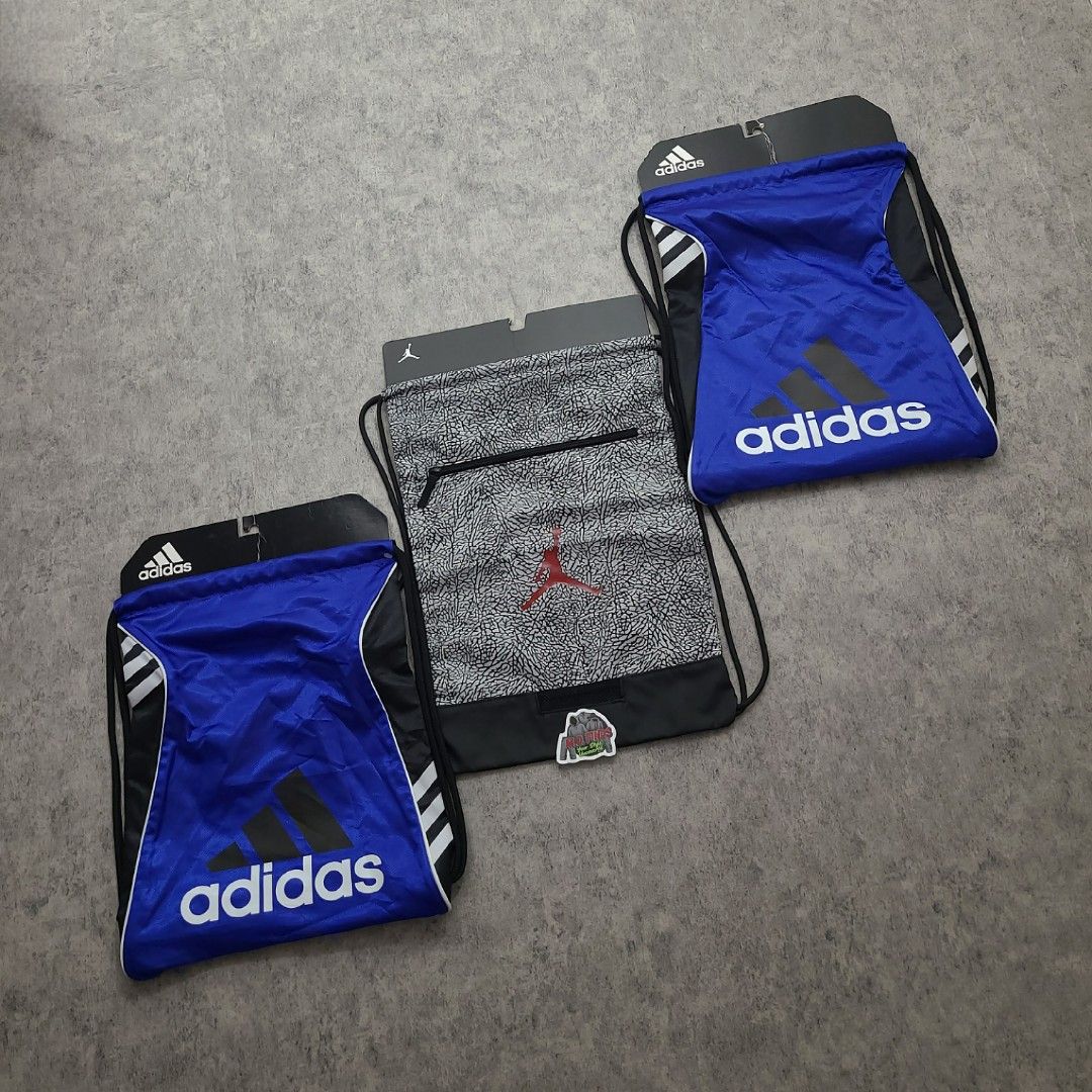 Adidas and Jordan Drawstring Bags Set (Category: Backpacks) located in Quezon City. Submitted by mofinds.ph (Listing ID 1469496450, Image 1). Description: Selling as BUNDLE PACK ONLY (3 PCS) — NOT SELLING SEPARATELY / NO SPLIT ​ALL BRAND NEW WITH TAGS (BNWT) 100% Authentic / Original MOP: BPI DELIVER: LALAMOVE OR J&T MEETUP/PICKUP: Victoria Tower D, Mother Ignacia Ave., Brgy. Paligsahan, Diliman, Quezon City.