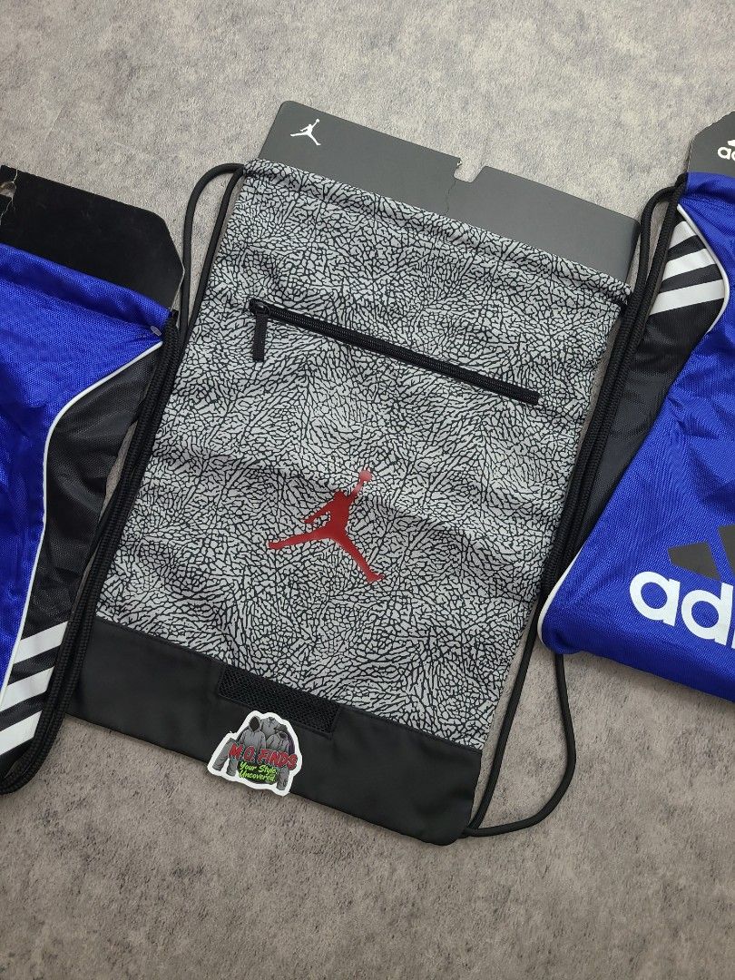 Adidas and Jordan Drawstring Bags Set (Category: Backpacks) located in Quezon City. Submitted by mofinds.ph (Listing ID 1469496450, Image 3). Description: Selling as BUNDLE PACK ONLY (3 PCS) — NOT SELLING SEPARATELY / NO SPLIT ​ALL BRAND NEW WITH TAGS (BNWT) 100% Authentic / Original MOP: BPI DELIVER: LALAMOVE OR J&T MEETUP/PICKUP: Victoria Tower D, Mother Ignacia Ave., Brgy. Paligsahan, Diliman, Quezon City.