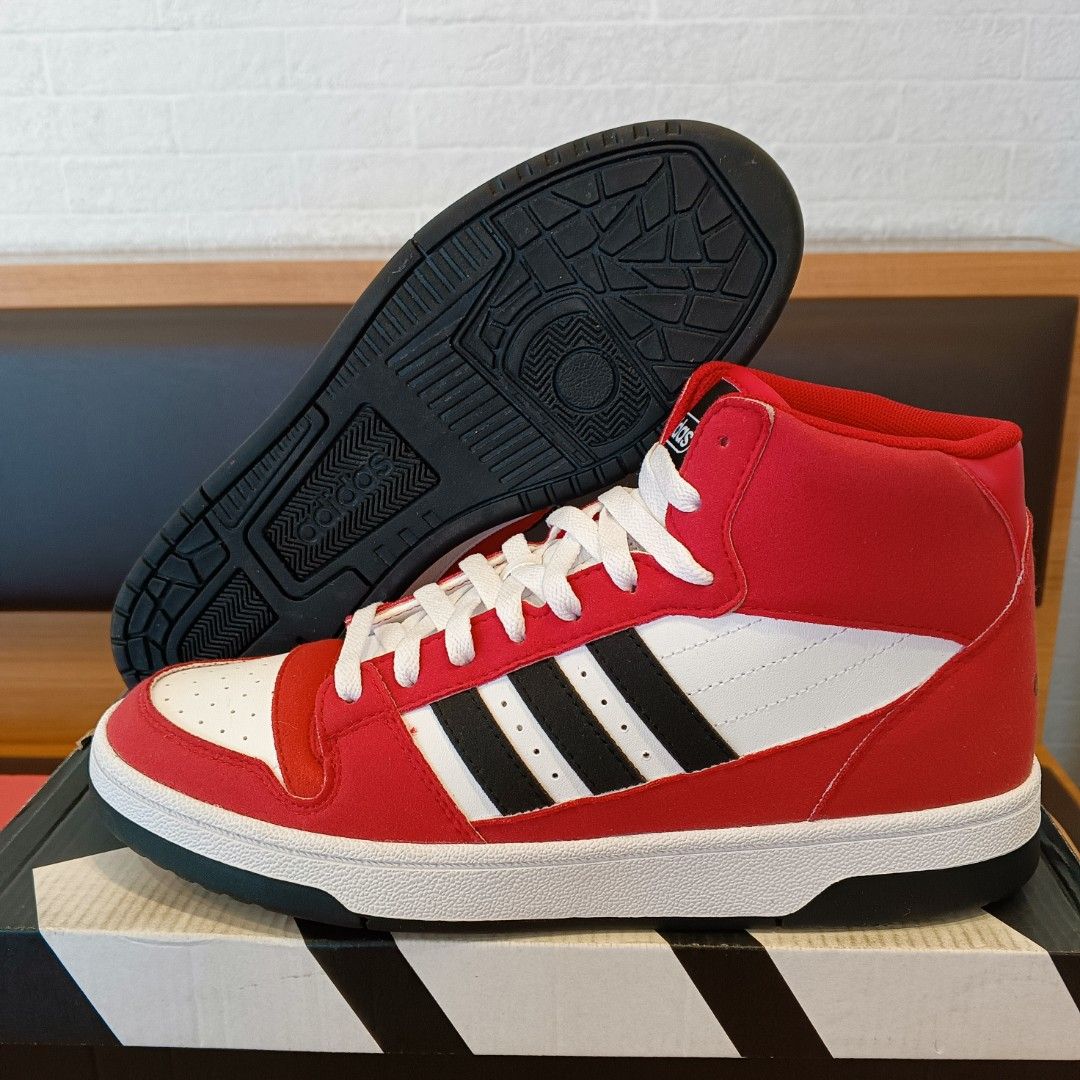 Adidas Break Start Mid Red Black White Sneakers (Category: Casual Shoes) located in San Pedro. Submitted by dimes.kicks26 (Listing ID 1469569656, Image 3). Description: Adidas Break Start Mid basketball shoes in red, white, and black colorway. Mid-top silhouette with classic three stripes and perforated toe box. Size US 9.5, Euro 43 1/3, UK 9. Original box included with visible tags and barcode. Clean soles and crisp uppers..