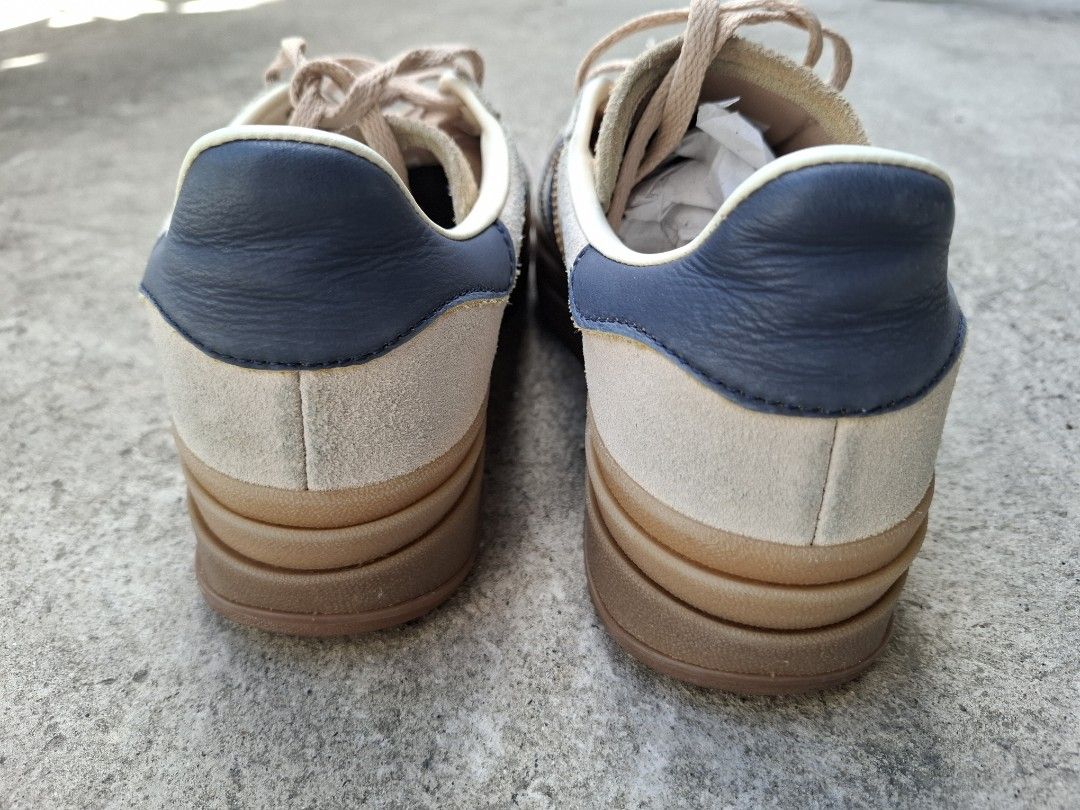 Adidas Gazelle Bold Clear Brown Navy (Category: Sneakers) located in Makati City. Submitted by itemsforless2025 (Listing ID 1469483850, Image 3). Description: - Brand: Adidas Gazelle Bold (Triple-stacked platform) - Colorway: Clear Brown suede with Navy Blue stripes and heel tab - Details: Iconic gold foil branding, beige laces, and classic gum rubber sole - Condition: Excellent, clean soles and crisp suede texture - Fit & Comfort: Comfortable pa