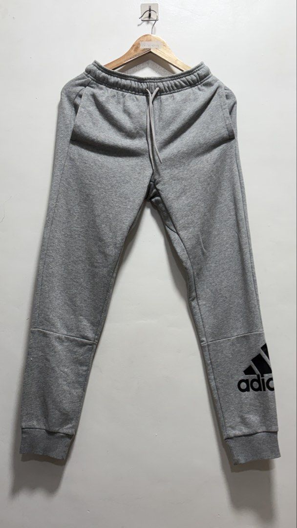 Adidas Gray Track Pants (Category: Coats, Jackets and Outerwear) located in Manila. Submitted by petlover777 (Listing ID 1469511800, Image 1). Description: Best fit to small 28-32 waist 38.5 length GOOD AS NEW! 🔥 no issue, bagong bago! 📍Location: Barangay 235 Zone 22 Villaruel St. Abad Santos Manila 🛵 J&T | Lalamove.