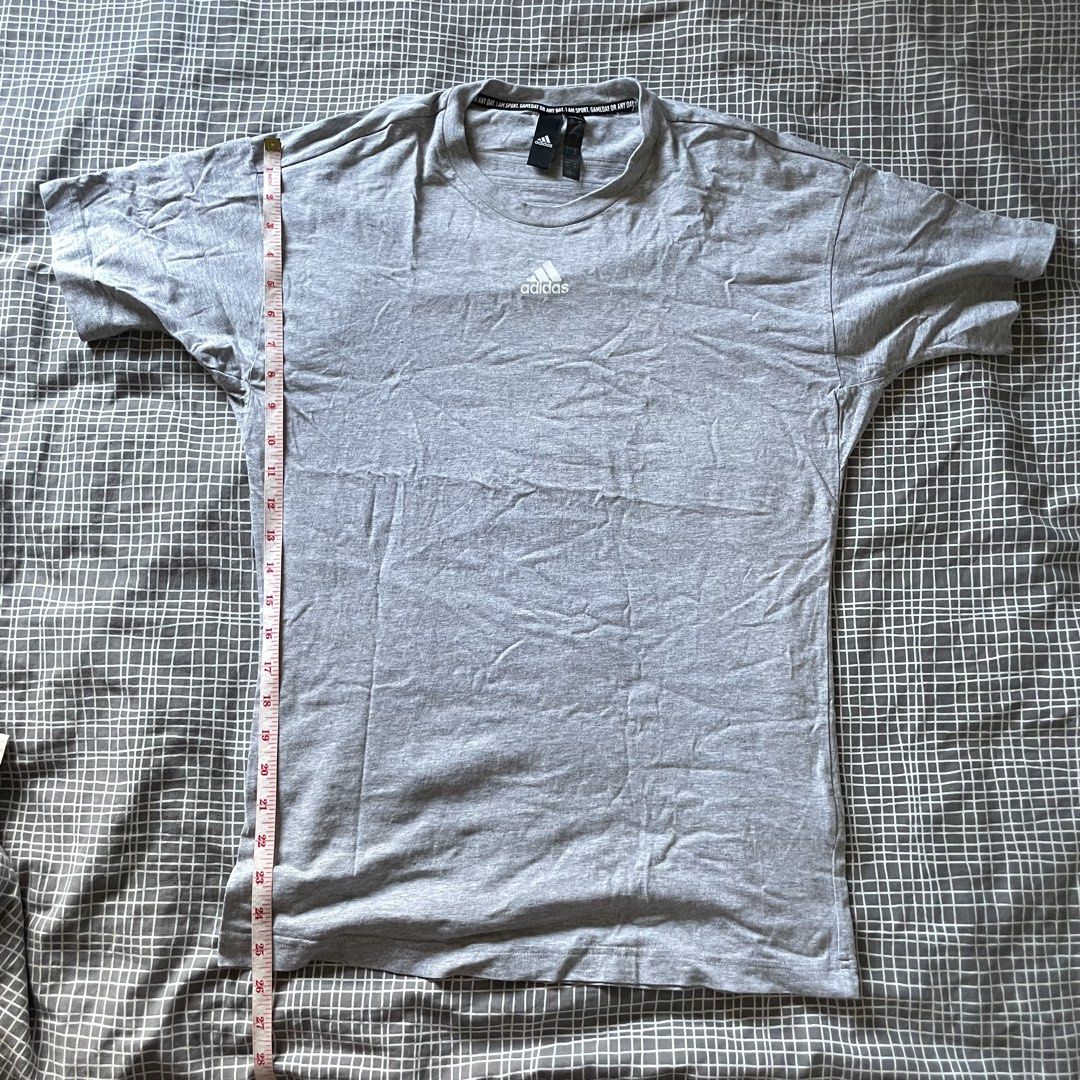 Adidas Grey Shirt (Category: Tshirts & Polo Shirts ) located in Mandaluyong City. Submitted by _javiii (Listing ID 1469415967, Image 1). Description: - Brand: Adidas - Color: Grey - Size: Fits S-M - Chest: Classic printed Adidas logo - Measurements: ~27 inches length, ~26 inches pit-to-pit - Condition: Slightly used.