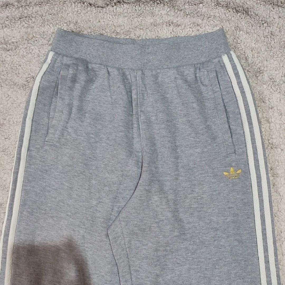 Adidas Grey Sweatpants with White Stripes Size M (Category: Other Bottoms) located in Manila. Submitted by anthonig (Listing ID 1469461546, Image 2). Description: Length: 39.5 inches Width: 26 inches (stretchable) Hem: 9 inches Price: 900 pesos Condition: 9.8/10 Issues: none PM if interested or for inquiries Meetups within MANILA only Can do shipping at buyers expense.