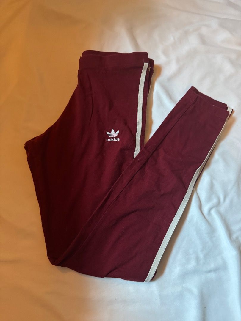 Adidas Maroon 3-Stripes Leggings Size S (Category: Activewear) located in Cebu City. Submitted by txproj27 (Listing ID 1469411321, Image 3). Description: - Brand: Adidas - Color: Maroon with white 3-stripes - Size: UK 10, US S, EU 36 - Material: Comfortable cotton blend with elastic waistband - Details: Small embroidered trefoil logo on the hip - Condition: Clean, excellent, and ready to wear - Origin: Made in Pakistan - Ideal for: Workouts or ca