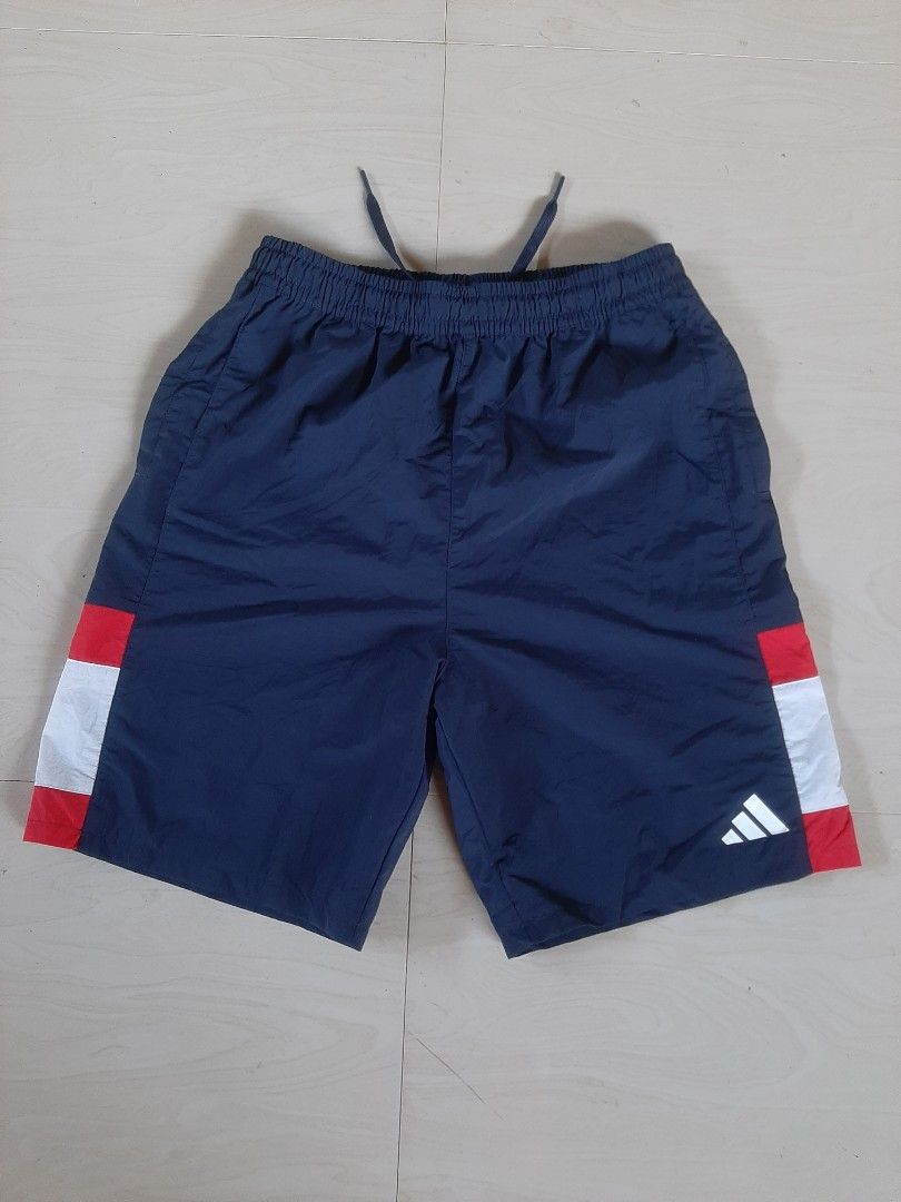 Adidas Three Stripes Woven Shorts (Category: Shorts) located in Himamaylan. Submitted by thriftsouth6108 (Listing ID 1469529592, Image 3). Description: adidas-Wording Pack Loose Fit Mesh-Lined Woven Shorts 29-32 Length: 18 As new no issue Colorate: 10/10 j&T courier can do shipping nationwide.