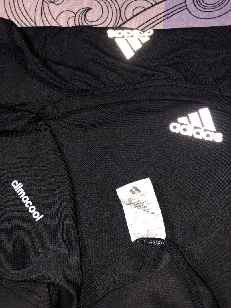 Adidas Training Climacool Tank Top Black 3XL (Category: Activewear) located in Manila. Submitted by bakithrift213 (Listing ID 1469518081, Image 3). Description: - Brand: Adidas Training - Color: Black - Size: 3XL (Multi-region) - Technology: Climacool for breathability - Material: Lightweight athletic fabric with contrast side panels - Details: Adidas logo on front chest and back neckline; 'ADIDAS TRAINING' printed on inner collar taping - Origin
