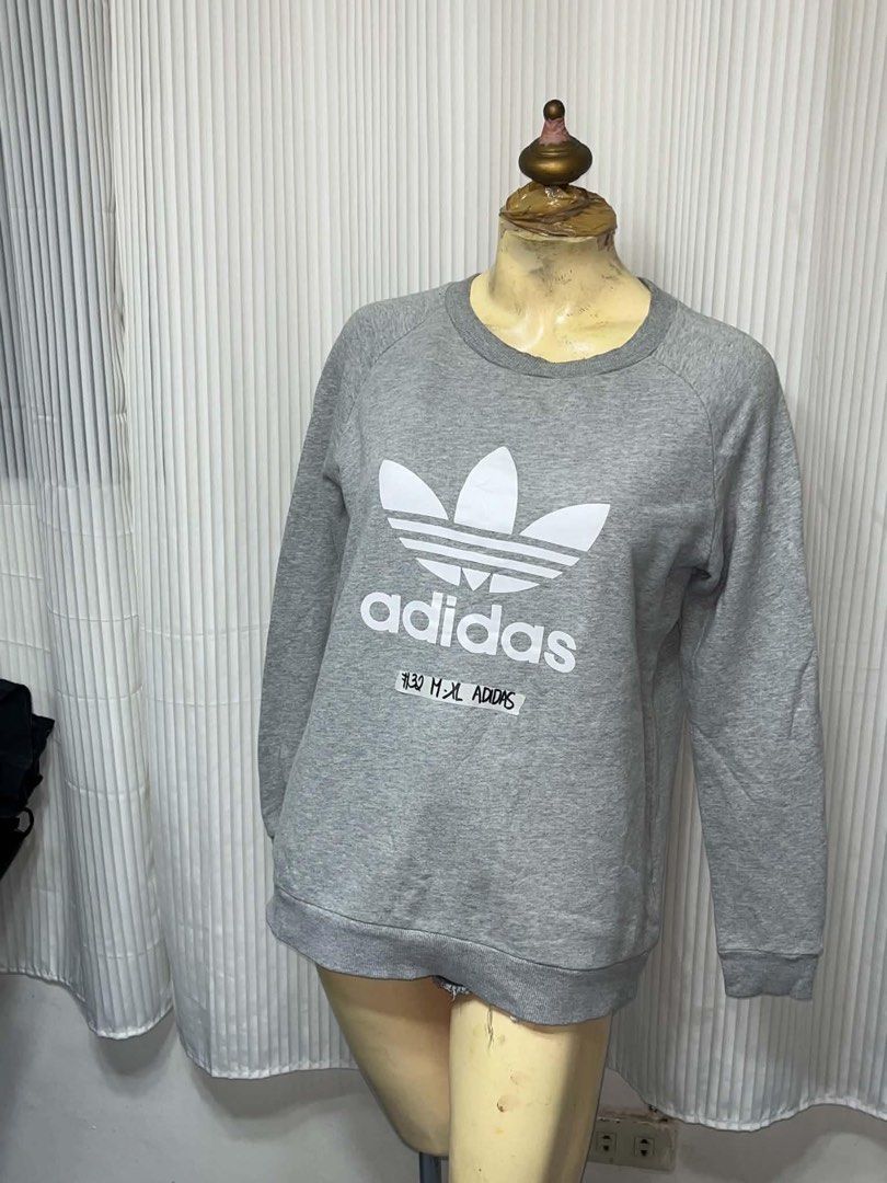 Adidas Trefoil Logo Grey Sweatshirt (Category: Coats, Jackets and Outerwear) located in General Trias. Submitted by crissy9053136 (Listing ID 1469444960, Image 1). Description: - Authentic grey Adidas sweatshirt - Iconic white trefoil logo on the chest - Classic crew neck with long sleeves - Ribbed cuffs and hem for a secure fit - Versatile everyday basic, pairs well with jeans or joggers.
