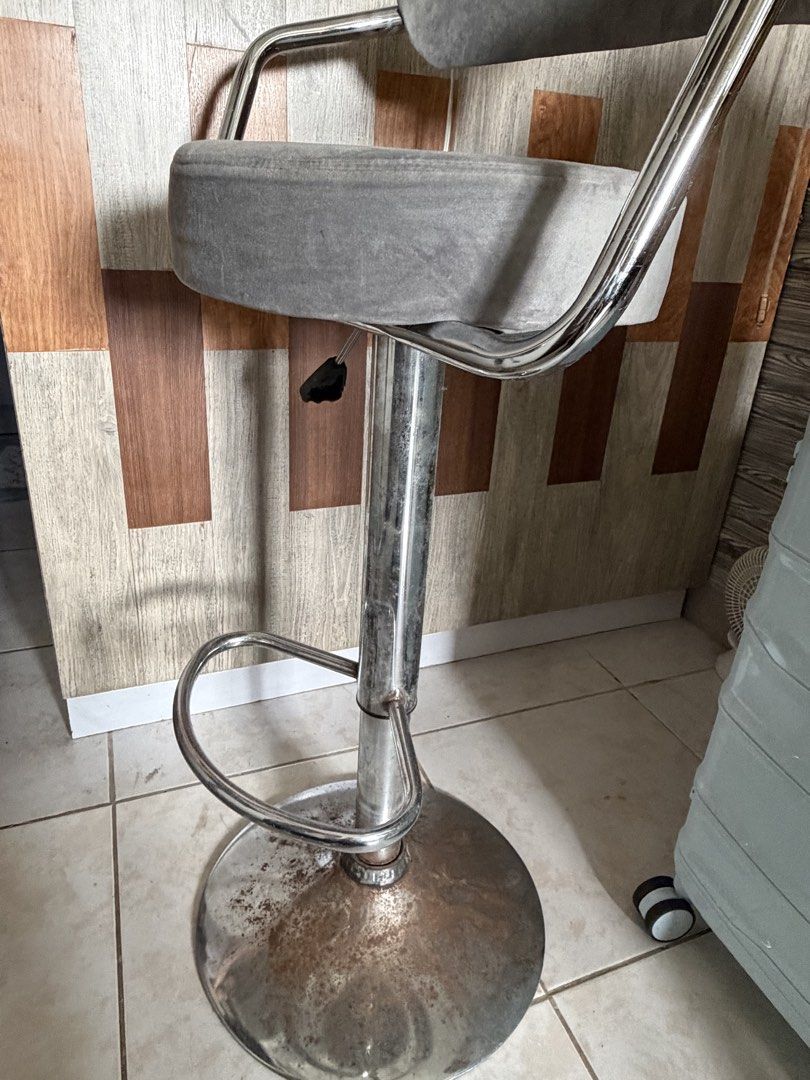 Adjustable Grey Velvet Bar Stool with Chrome Base (Category: Chairs) located in Manila. Submitted by kfr48k6fyt98448 (Listing ID 1469401437, Image 1). Description: - Colour/Material: Grey velvet upholstery with a padded cushion for comfort - Frame: Chrome frame with a footrest attached to the central pole - Functionality: Fully working hydraulic height adjustment lever for standard counter height - Condition: Metal base has heavy visible rust pat