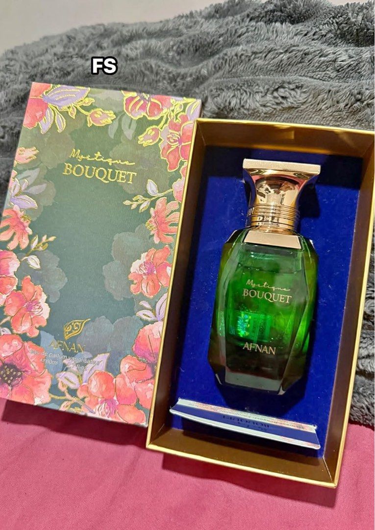 Afnan Mystique Bouquet Eau de Parfum 80ml (Category: Fragrance & Deodorants) located in Manila. Submitted by beabelotin59176 (Listing ID 1469464463, Image 1). Description: - Authentic Afnan Mystique Bouquet Eau de Parfum - Generous 80ml bottle size - Stunning green glass flacon featuring an elegant gold cap - Comes complete with the original floral patterned presentation box - Features a luxurious blue velvet display insert inside - Ideal for dai