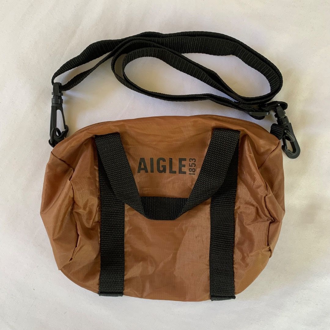 Aigle Mini Duffle Sling Bag (Category: Hiking & Camping) located in Mendez-Nunez. Submitted by anikkoyan (Listing ID 1469500730, Image 1). Description: Aigle Mini Duffle Sling Bag Length: 8.5 Width: 10.5 - Like new 599 + sf.