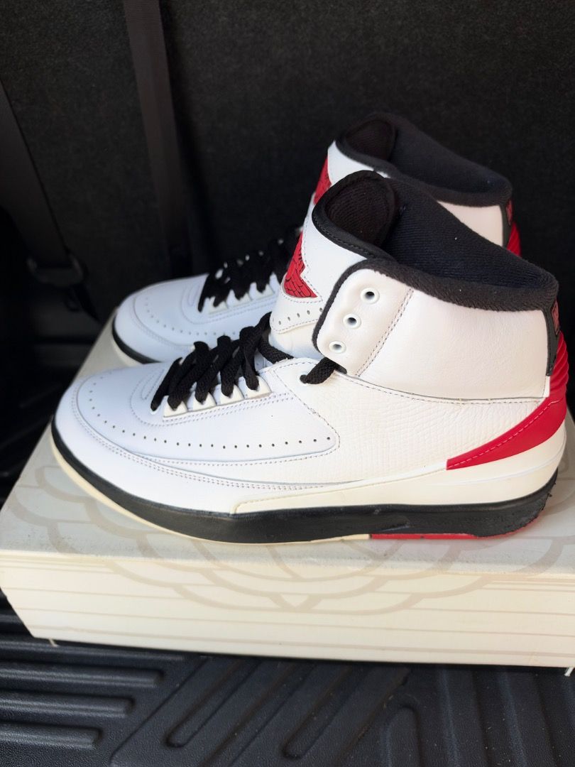 Air Jordan 2 Chicago (Category: Sneakers) located in Caloocan City. Submitted by luckydeer_4f53ea (Listing ID 1469441850, Image 1). Description: - Model: Air Jordan 2 Retro - Colorway: White, Black, and Red - Design: High-top silhouette with classic leather and premium faux-lizard skin texture panels - Features: Perforated toe box, Nike branded heel tabs, and sleek black midsole - Condition: Used with original box included - Mode of Payment: GCas