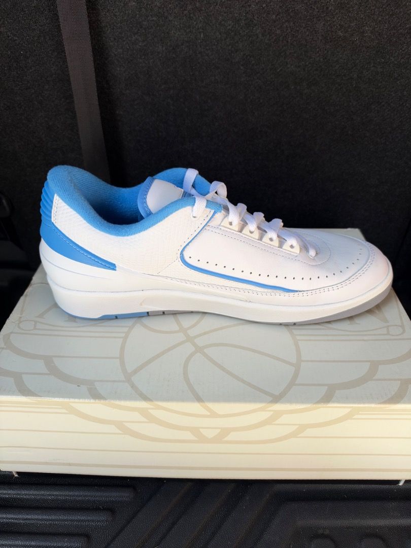 Air Jordan 2 Retro Low UNC White University Blue (Category: Sneakers) located in Caloocan City. Submitted by luckydeer_4f53ea (Listing ID 1469442015, Image 3). Description: - Condition: Brand new, never worn, pristine condition - Included: Original box - Colorway: Classic UNC (White leather base with University Blue accents) - Design: Low-top silhouette with toe box perforations and signature molded heel counter - Authenticity: 100% authentic, st