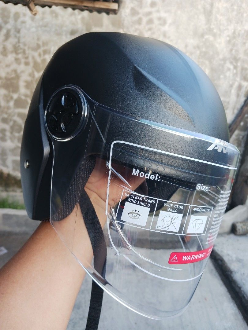 AKA Matte Black Motorcycle Helmet with Visor (Category: Caps & Hats) located in Cebu City. Submitted by joecristinesayson (Listing ID 1469570512, Image 1). Description: - Brand: AKA - Type: Half-face urban riding helmet - Color: Matte Black (Clean, brand new, and unused) - Visor: Twin shield system (Clear outer visor + retractable dark inner sun shield) - Condition: Protective film still attached to both visors - Safety: BPS certified sticker on 