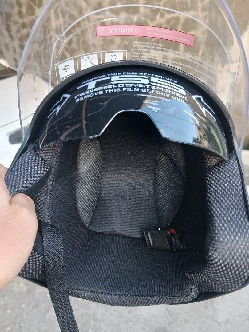 AKA Matte Black Motorcycle Helmet with Visor (Category: Caps & Hats) located in Cebu City. Submitted by joecristinesayson (Listing ID 1469570512, Image 3). Description: - Brand: AKA - Type: Half-face urban riding helmet - Color: Matte Black (Clean, brand new, and unused) - Visor: Twin shield system (Clear outer visor + retractable dark inner sun shield) - Condition: Protective film still attached to both visors - Safety: BPS certified sticker on 