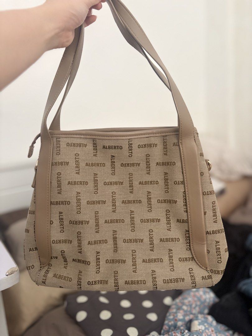 Alberto Beige Monogram Tote Bag Shoulder Bag (Category: Shoulder Bags) located in Pasay City. Submitted by chacha_15 (Listing ID 1469413386, Image 1). Description: - Authentic ALBERTO monogram print on clean beige canvas - Secure zippered top closure Few times pa lang nagamit hehe Bought for 2k plus.