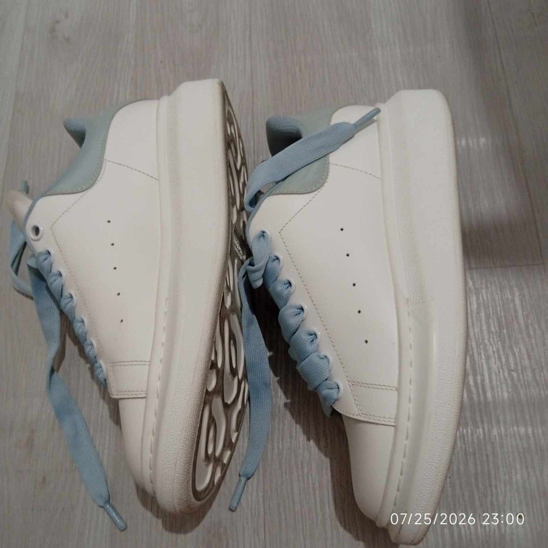 Alexander McQueen Oversized Sneakers White Light Blue (Category: Sneakers) located in Taguig. Submitted by manilyn_lau (Listing ID 1469548057, Image 2). Description: - Brand: Alexander McQueen - Style: Oversized platform sneakers - Color: White with light blue heel tabs and matching thick laces - Size: EU 39 (stamped inside tongue) - Condition: Clean uppers with minimal wear on bottom treads - Features: Signature chunky rubber sole, classic luxur