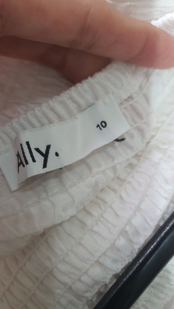 Ally White Smocked Dress Size 10 (Category: Babies & Kids Fashion) located in Santa Rosa. Submitted by regcruz (Listing ID 1469403822, Image 2). Description: - Brand: Ally Rustans - Size: 10 - Color: White - Style: Sleeveless dress with flared skirt - Details: Smocked bodice with textured fabric, includes shoulder straps - Condition: Clean, EUC, and ready to wear.