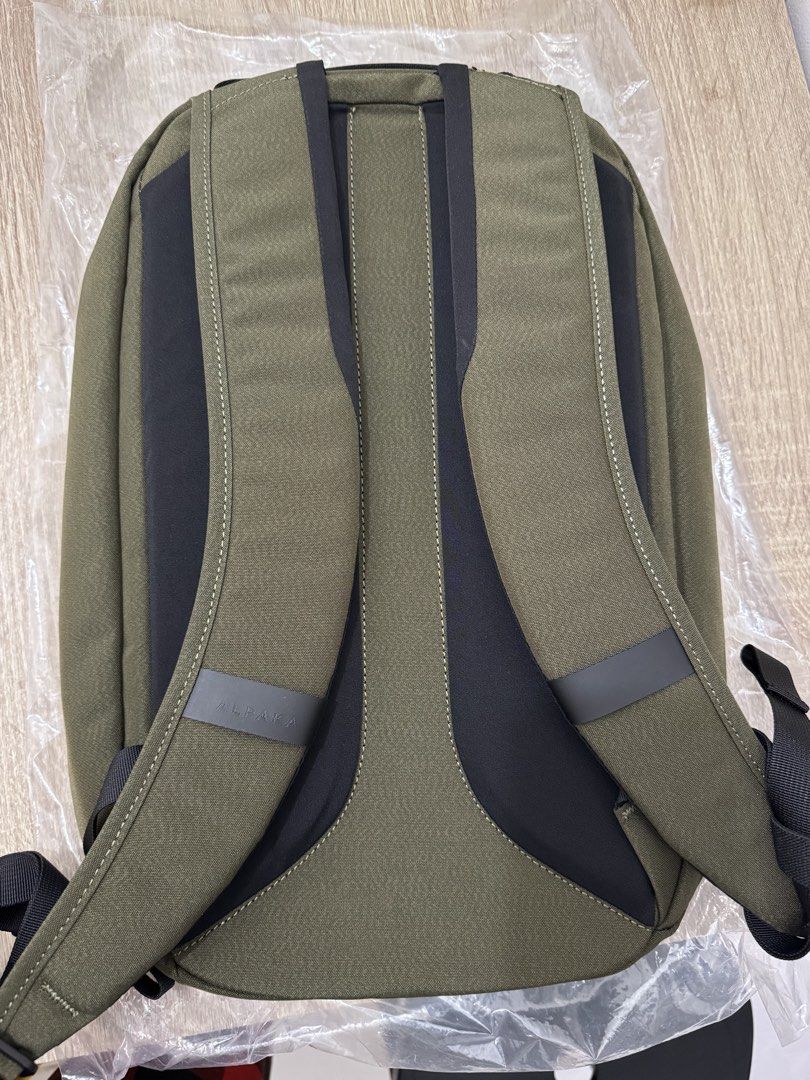 Alpaka Metro Backpack 12L Olive Green (Category: Backpacks) located in Pasay City. Submitted by yellowmellow01 (Listing ID 1469428509, Image 2). Description: - Brand new and unused with original tags attached - Color: Olive Green - Capacity: 12L compact everyday carry - Main compartment features internal organization pockets and a dedicated laptop sleeve - Comfortable padded shoulder straps with signature branded loop - Convenient front vertical 