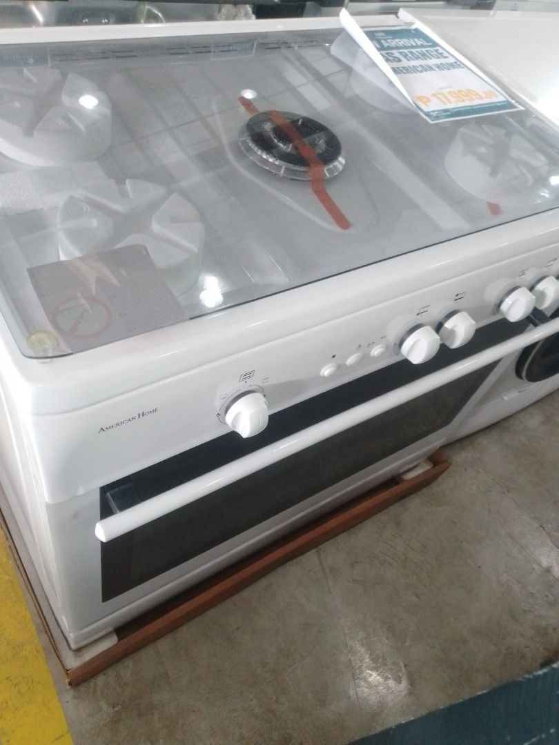 American Home Gas Range White Oven (Category: Cookers) located in Manila. Submitted by maryjane09. (Listing ID 1469455826, Image 3). Description: - Brand new white gas range stove with built-in oven compartment - 5 top burners including a central burner element for versatile cooking - Equipped with a protective glass cover and easy-to-use front control knobs - Factory-fresh unit mounted on a wooden base pallet with tag attached - Perfect upgrade 