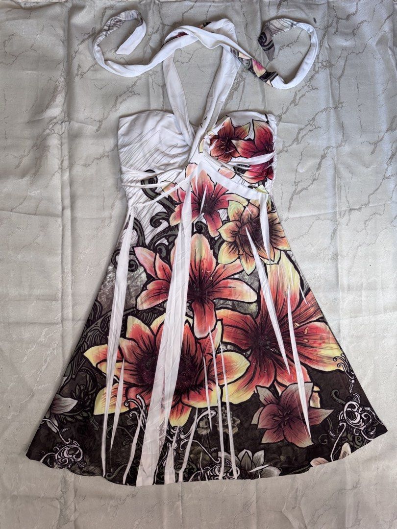 Anahi Floral Halter Dress (Category: Dresses) located in Legazpi City. Submitted by satowa00 (Listing ID 1469463216, Image 1). Description: - Brand: Anah - Style: Halter neck dress with gathered bust detailing - Print: Vibrant pink and yellow lily floral print on a dark and white base - Size: Small - Origin: Made in USA - Condition: Great piece for summer days or vacation - DM for inquiries or fast shipping!.