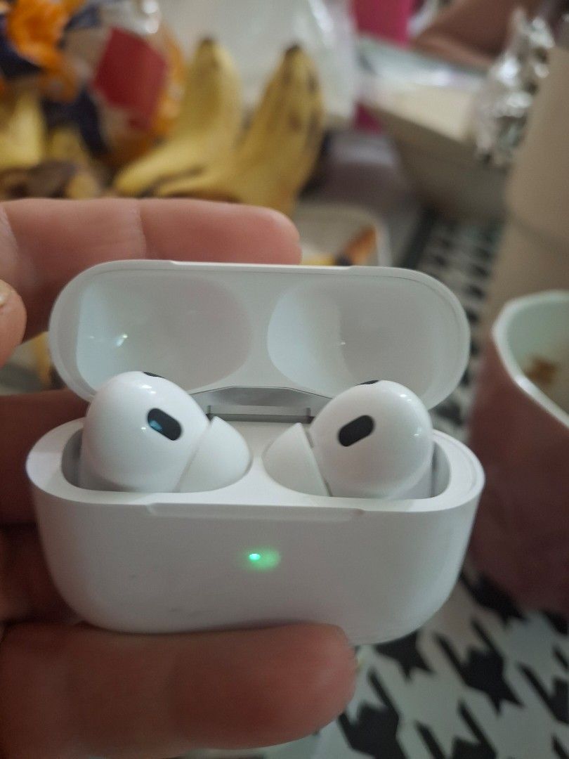 Apple AirPods wireless charging case with earbuds (Category: Earphones) located in Pasig City. Submitted by franzean (Listing ID 1469459699, Image 1). Description: - Authentic Apple wireless earbuds with charging case - Glossy white finish with green status light active - Standard pod design featuring black acoustic mesh vents - Clean interior inside the charging lid - 100% tested and working properly - Meet-ups and shipping available across the 