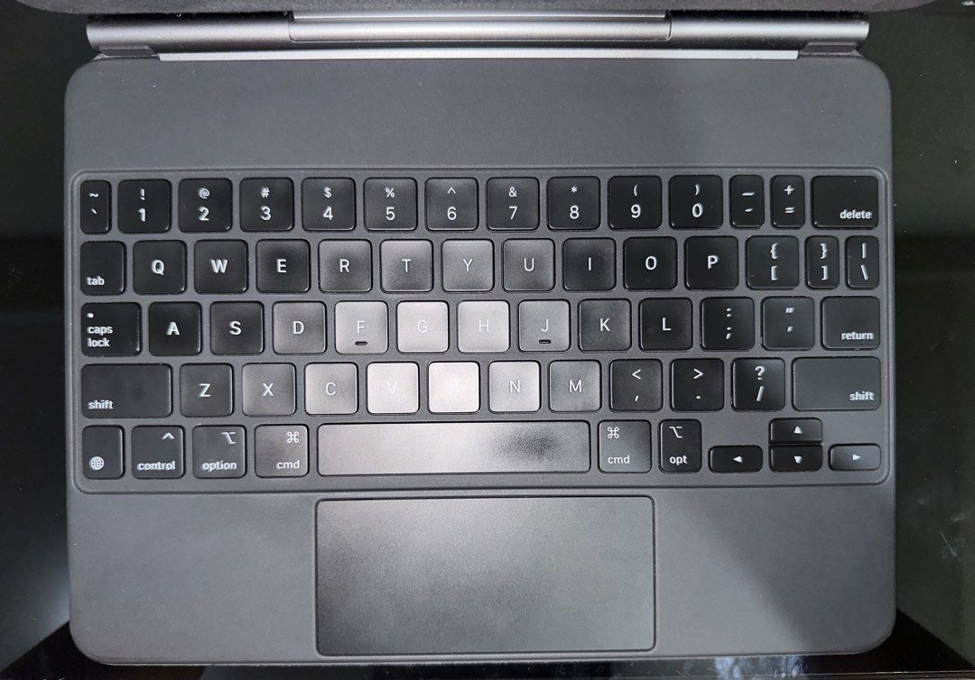 Apple iPad Magic Keyboard (Authentic) (Category: Computer Keyboard) located in Manila. Submitted by goodfindsmnl_ (Listing ID 1469507910, Image 2). Description: - Original Apple accessory (serial number verification available) - Complete with original box and manual - Lightly used and well-maintained - Minimal signs of use - Slight sticker mark on the Apple logo (barely noticeable) - Compatible iPad models: see last photo for reference - Send you