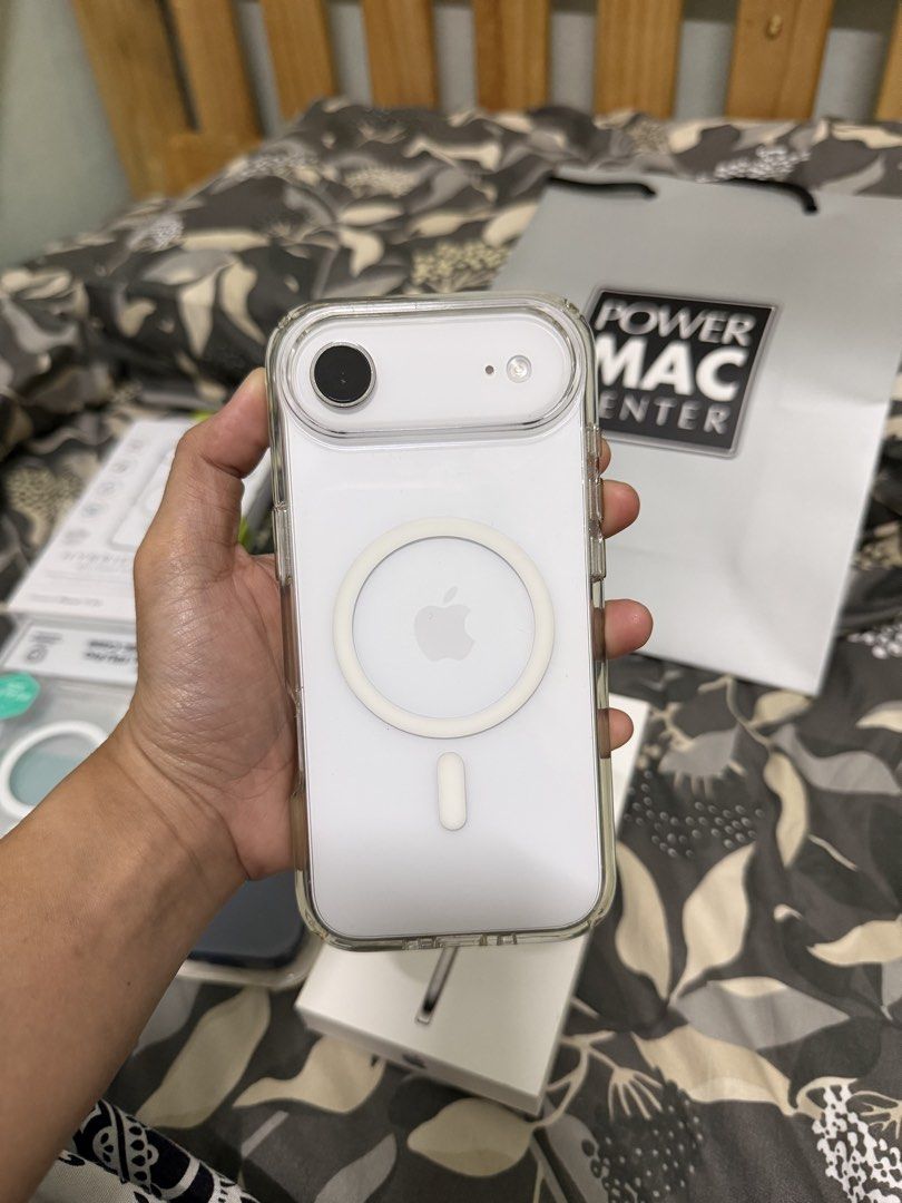 Apple iPhone Air Cloud White 256GB with extra cases (Category: iPhone Air Series) located in Manila. Submitted by safeeagle_456c88 (Listing ID 1469434054, Image 1). Description: - Model: Apple iPhone Air - Color: Cloud White - Storage: 256GB - Inclusions: Original retail box and Power Mac Center shopping bag - Freebies: 3 extra cases included (QDOS Hybrid Drop clear case, Nillkin magnetic clear case, and dark blue silicone case) - Condition: Exce