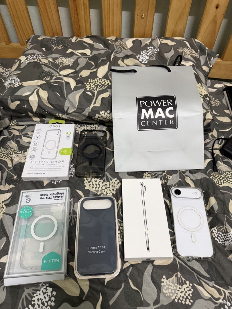 Apple iPhone Air Cloud White 256GB with extra cases (Category: iPhone Air Series) located in Manila. Submitted by safeeagle_456c88 (Listing ID 1469434054, Image 3). Description: - Model: Apple iPhone Air - Color: Cloud White - Storage: 256GB - Inclusions: Original retail box and Power Mac Center shopping bag - Freebies: 3 extra cases included (QDOS Hybrid Drop clear case, Nillkin magnetic clear case, and dark blue silicone case) - Condition: Exce