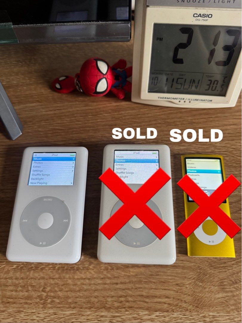 Apple iPod Classic (Category: Portable Music Players) located in Davao. Submitted by amiri.awatif (Listing ID 1467227252, Image 2). Description: three Apple iPods including two classic white models and one yellow nano. Capacities include 20GB (SOLD) and 60GB for the classics (SOLD), and 8GB for the nano (SOLD). Click wheels fully responsive. Screens display menus clearly without dead pixels. Syncs via Windows format. Battery holds charge. With Or