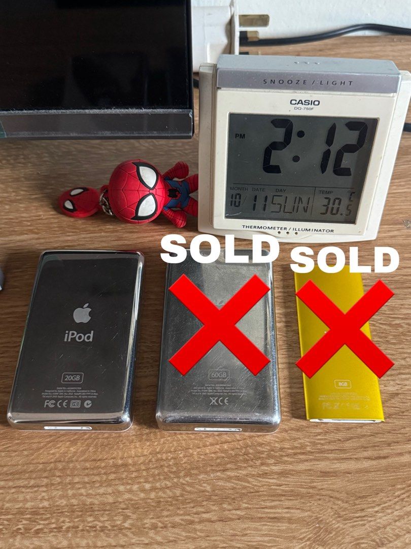 Apple iPod Classic (Category: Portable Music Players) located in Davao. Submitted by amiri.awatif (Listing ID 1467227252, Image 3). Description: three Apple iPods including two classic white models and one yellow nano. Capacities include 20GB (SOLD) and 60GB for the classics (SOLD), and 8GB for the nano (SOLD). Click wheels fully responsive. Screens display menus clearly without dead pixels. Syncs via Windows format. Battery holds charge. With Or