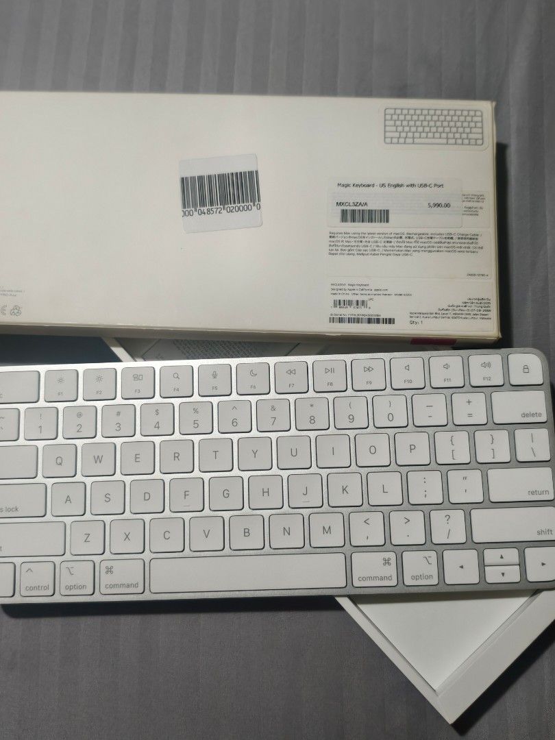 Apple Magic Keyboard with USB-C Port US English (Category: Computer Keyboard) located in Manila. Submitted by cleverdeer_e2f36c (Listing ID 1469459760, Image 1). Description: - Model: Apple Magic Keyboard with USB-C Port - Layout: US English - Color: Silver aluminium body with white keys - Condition: Brand new, taken straight out of packaging, zero dust or wear - Compatibility: Works smoothly with Mac and iPad - Inclusions: Original retail box in